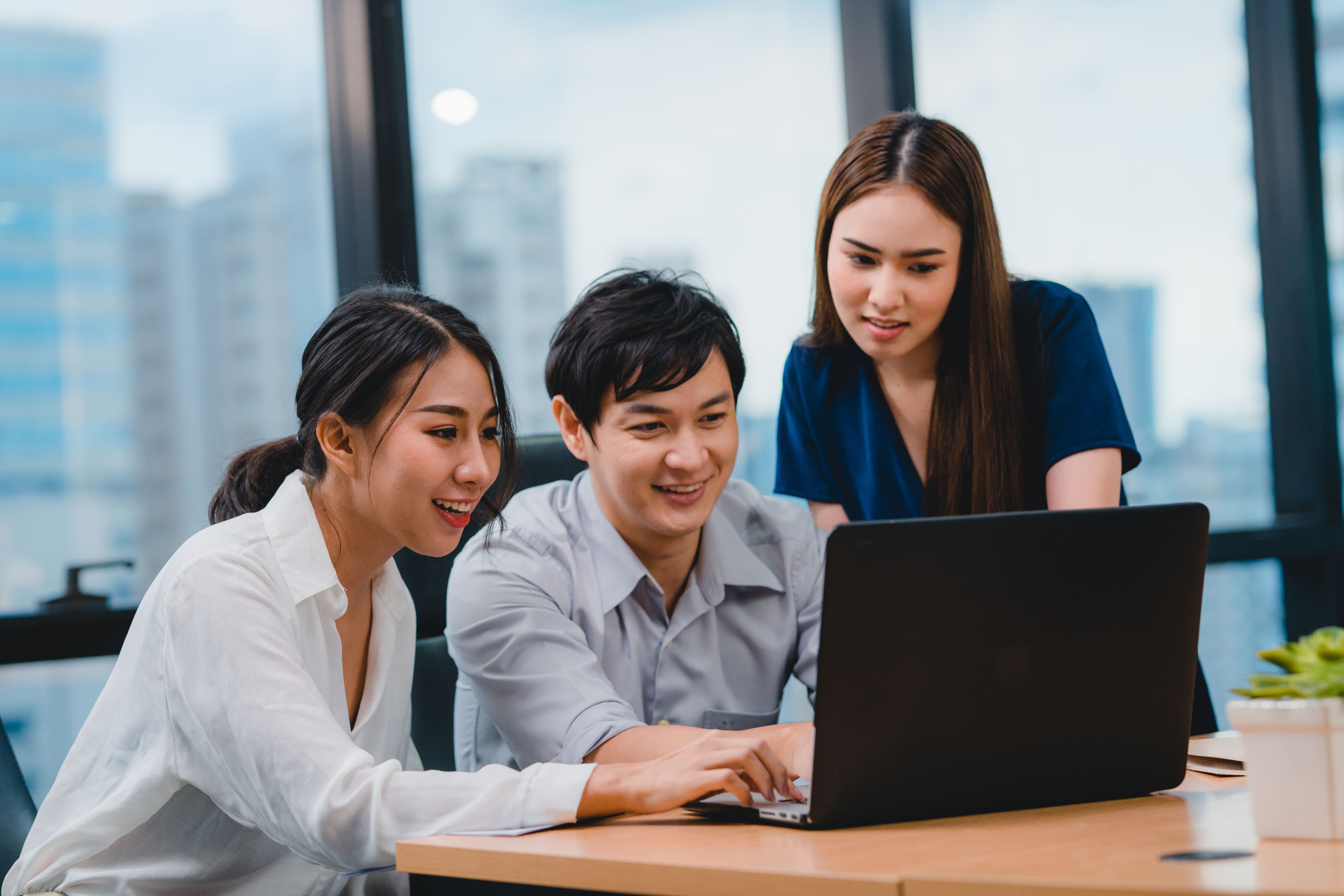 collaborative-process-multicultural-businesspeople-using-laptop-presentation-communication-meeting-brainstorming-ideas-about-project-colleagues-working-plan-success-strategy-modern-office (1).jpg