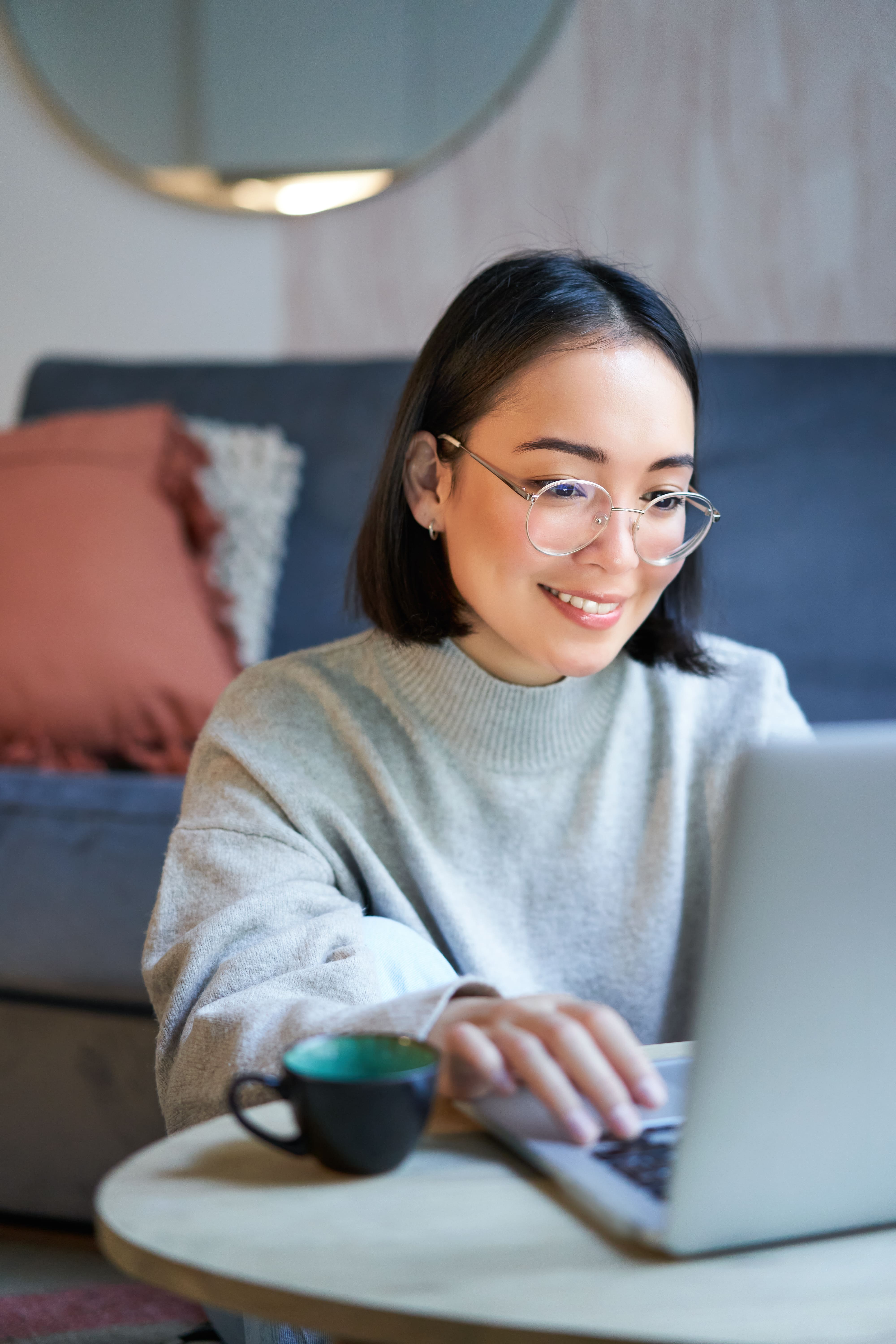 young-asian-girl-freelancer-professional-sitting-living-room-working-with-computer-studying (1).jpg